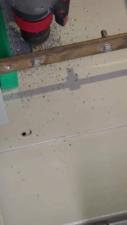 Close up video of using a power drill to make a hole in a metal plate. Stock-Footage 339049316
