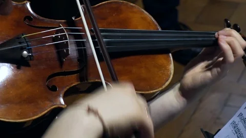 Close-up video of a violinist's hands playing the violin or viola Video stock 112179949