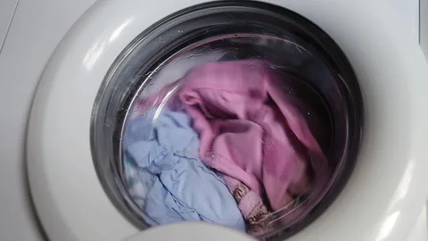 Close up video of washing machine. Laundry machine washing clothes Stock Footage 255437582
