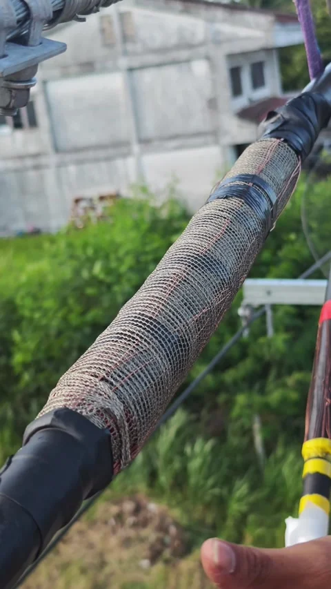 Close up video of worker hands installing a black outer protective. Stock Footage 345128899