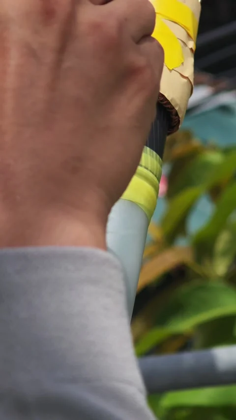 Close up video of wrapping yellow void filling mastic tape between semicond. Видео 340278050
