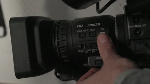 Close-up of a videographer adjusting audio levels Stock Footage 335140585