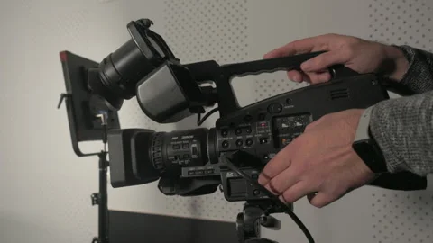 Close-up of a videographer adjusting audio levels 스톡 동영상 335141240