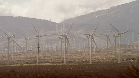 The close-up videoshots of windmills in the valley Stock Footage 77056238