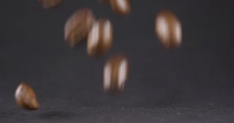 Close Up Viev of Coffee Beans and Ground Coffee Fall. Slow motion. Coffe Product Stock Footage 104623399