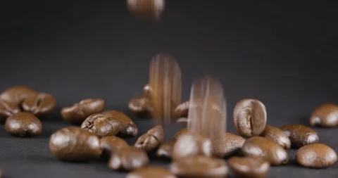 Close Up Viev of Coffee Beans and Ground Coffee Fall. Slow motion. Coffe Product Stock Footage 104624165