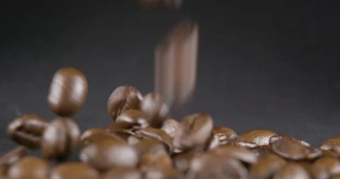 Close Up Viev of Coffee Beans and Ground Coffee Fall. Slow motion. Coffe Product Stock Footage 104624886