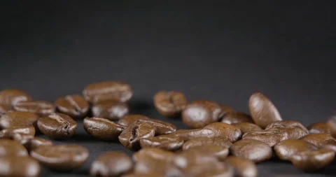 Close Up Viev of Coffee Beans and Ground Coffee Fall. Slow motion. Coffe Product Stock Footage 104625039