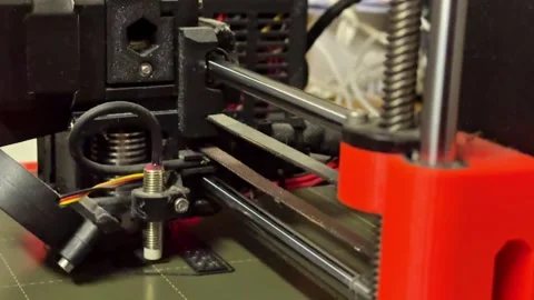Close-up view of 3D printer components in action, showcasing intricate Stock Footage 322522949