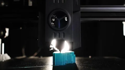 Close up view of 3D printer creating plastic detail on factory floor Video stock 325569771