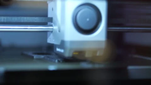 Close-up view of 3D printer creating object layer by layer Видео 344645069