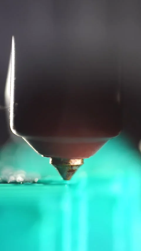 Close-up view of a 3D printer forming a plastic model through layered printing Stock Footage 321967688
