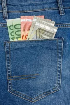 Close Up View to 5, 10, 100 Euro Banknotes Sticking Out From a Blue Jeans Pocket Stock Photos