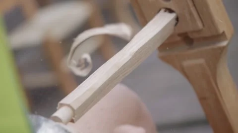 Close-up view about the chair maker's wood shaping process with his tool, Italy. Video stock 297262485