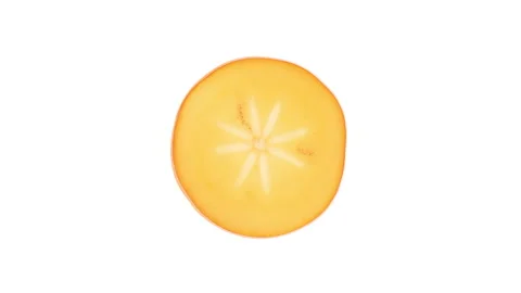 Close-up view from above of a half cut kaki fruit. Rotating on white background. Stock Footage 166225805