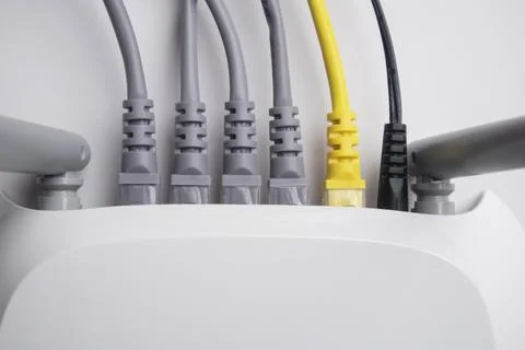 Close-up view from above showing the back panel of a white wireless router .. Stock Photos