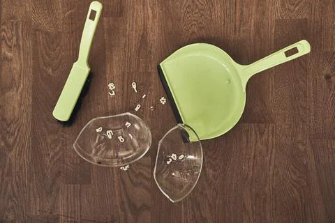 A close-up view from above of a split transparent cup with soup and brushes with Fotos de archivo