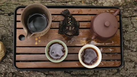 Close-up. view from above. tea set for chinese tea ceremony. dark pu-erh Stock Footage 220415369