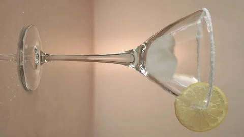 Close Up View Adding Ice Cubes Into A Glass And Pouring Cocktail Stock Footage 121445276