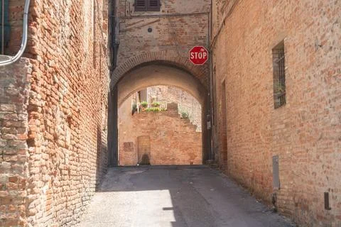 Close view of aged brick wall texture in historic european town Stock Photos