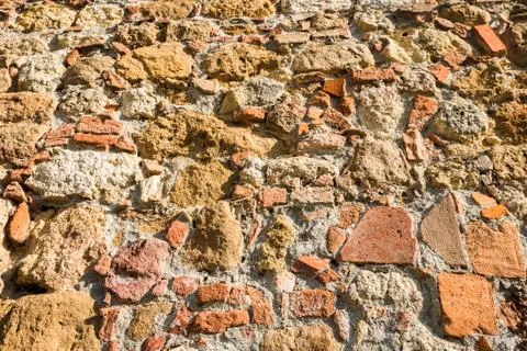 Close up view of an aged textured stone wall Stock Photos