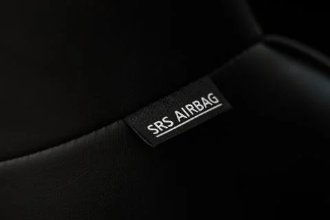 Close up view of airbag label on the side of a car seat. Airbag safety system Stock Photos