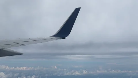 Close Up View of Airplane Wing During Flight. Slow Calm Cruising Through Cl.. Video stock 319593037