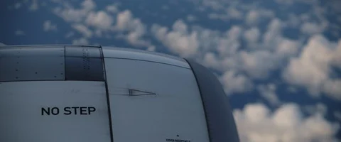 Close up view of an airplane's engine during the flight with clouds and sky Stock Footage 127136442