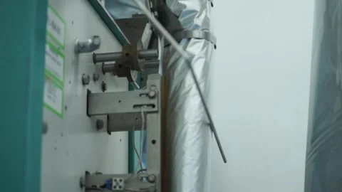 Close-up view of the aluminum foil packaging machine Stock Footage 260865013