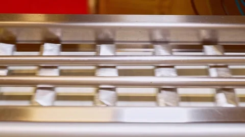 A close-up view of aluminum foil-wrapped chocolate bars Vídeos de archivo 323354829