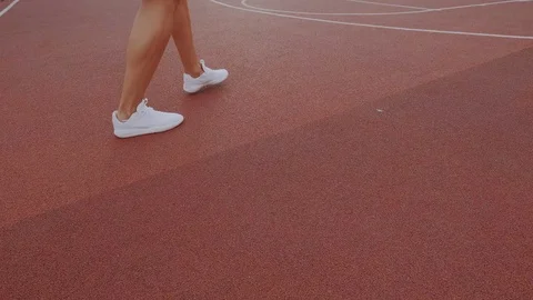 Close-up view of ambitious and focused basketball or streetball female player Stock Footage 115396751