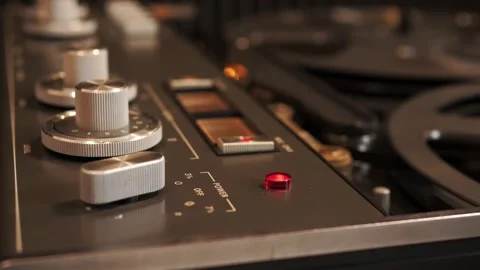 Close view of analog tape reels and control knobs 스톡 동영상 319891153