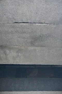 Close-up view of ancient andesite stone block wall texture on a historical Stock Photos
