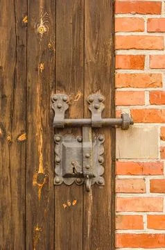 Close-up view of an ancient door key lock on an old wooden door Stock Photos