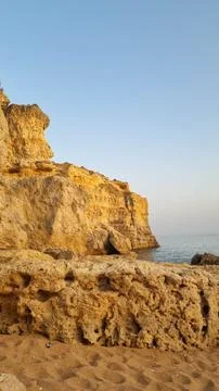 Close-up view of ancient weathered limestone cliffs featuring natural caves,  Fotos Stock