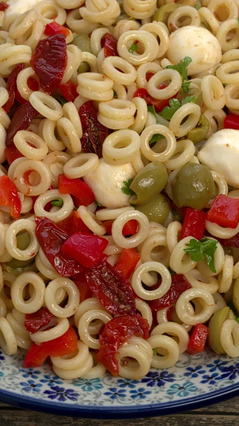 Close-up view of anelli siciliani pasta salad. Vertical video. Stock Footage 299930679