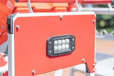 Close-up view of an angled, indoor image of a rectangular panel on orange-red Stock Photos