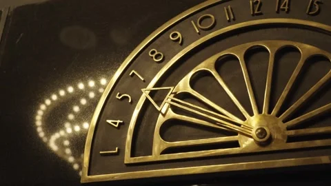 Close up view on Antique bronze dial indicator for the movement of the elevator Stock Footage 293677735