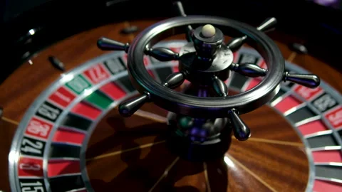 A close-up view of an antique roulette wheel spinning, revealing the thrill of Stock Footage 302095278