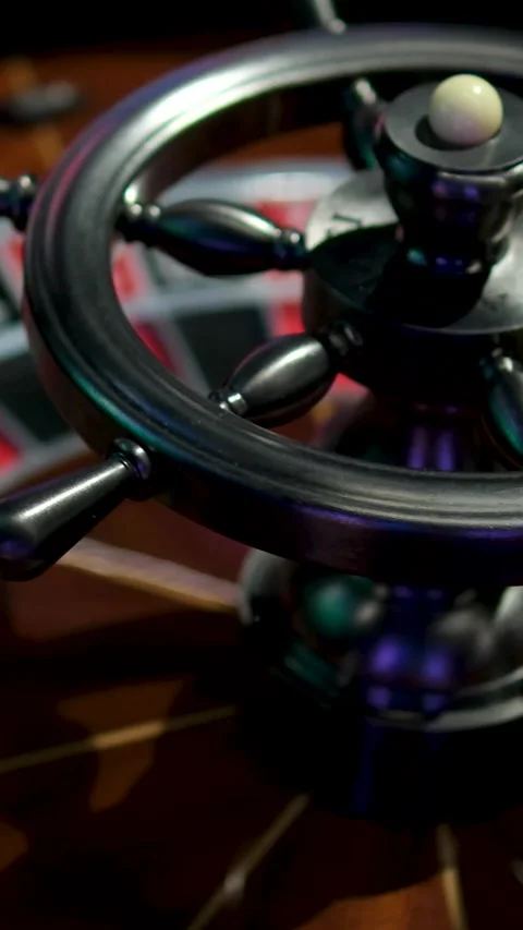 A close-up view of an antique roulette wheel spinning, revealing the thrill of Video stock 302813399