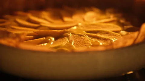 Close-up view of an apple pie baking in the oven, time lapse. Food photography. Stock Footage 285955311