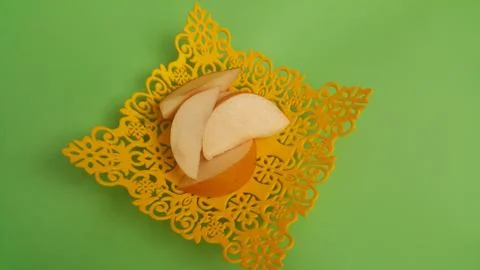 Close up view of apple slices placed in plastic yellow changair or container  Stock Photos