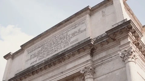 Close-up view of the Arch of Titus in Rome, Italy. Camera moving down Stock Footage 73752621