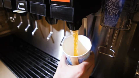 Close view aromatic tea poured into cup from machine in cafe Stock Footage 96021091