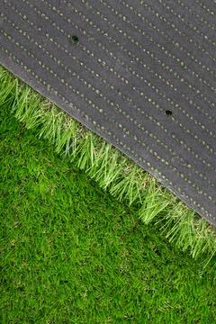 Close-up view of artificial grass texture with visible stitching and backing Stock Photos