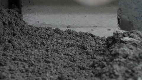 Close-up view of asphalt or concrete mass moved by road paver Stock Footage 158049859