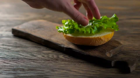 Close up view of assembling a beef hamburger Video stock 65720737