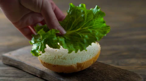 Close up view of assembling a beef hamburger Stock Footage 65720891