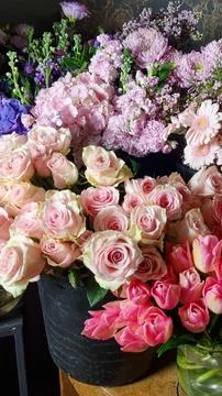 Close-up view of assorted fresh flowers in a florist shop, featuring pastel pink Stock Photos