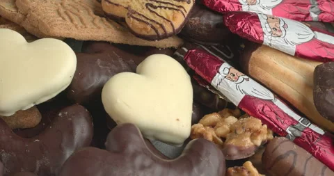 Close-up view of an assortment of Christmas sweets chocolate and cookies. Stock Footage 284275392
